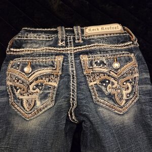 Rock Revival Distressed Blue Jeans with Embellished Pockets